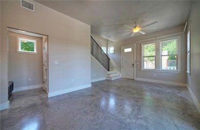 Mud room with built-in bench and half bath behind door.