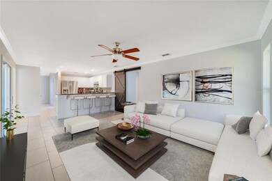 The kitchen overlooks a generous family room featuring CROWN MOLDING and chic BARN DOOR to accent the space! Virtually Staged. 