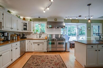 This kitchen is a cook's dream! Large gas cooktop, 3 ovens & built-in microwave.