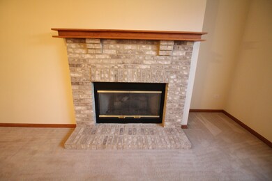 Living Room Brick Fireplace with Oak Mantel