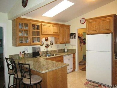 Beautiful Kitchen with granite counter tops, maple