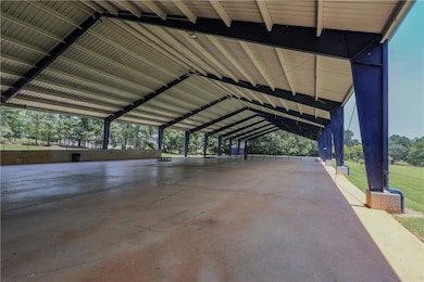 Garage featuring view of wooded area