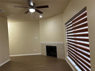 Unfurnished living room with a fireplace, visible 