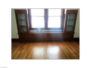Beautiful wood built-ins with leaded glass detail in dining room