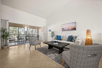 Tiled living area with a towering ceiling