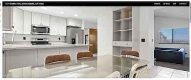 Newly remodeled kitchen with open floor plan and views of Templeton vineyards.