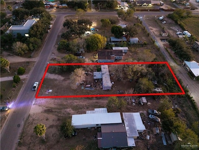 Aerial view of property and surrounding area with property boundaries highlighted