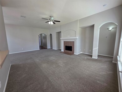 Another view of the living area and fireplace.