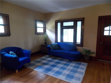 Living room has hardwood floor and lovely oak wood
