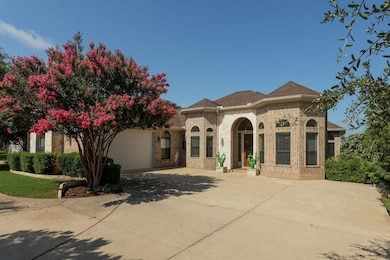 French country inspired facade featuring an attac