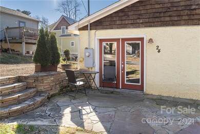 rock patio leading into bedroom through french door