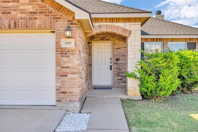 Doorway to property featuring a garage