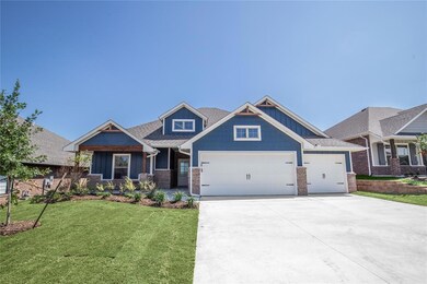 Craftsman house featuring a front lawn and a garage