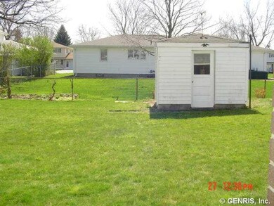 Outbuilding. Large open back yard.