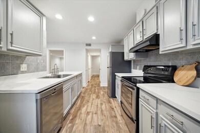 The updated kitchen has plenty of counter and storage space.