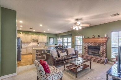 CHARMING living room with brick fireplace.  Notice