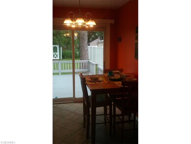 DINING AREA WITH PATIO DOOR THAT LEADS TO THE LARG