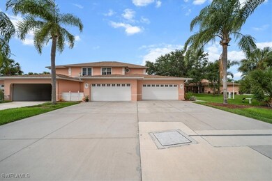 Traditional home with stucco siding, driveway, an