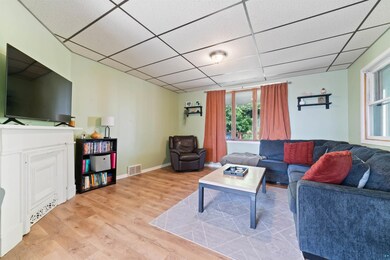 Living room featuring light hardwood / wood-style 