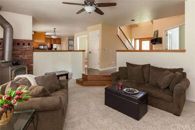 Family Room looking into kitchen and front entry