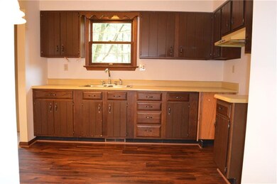 The Eat-In-Kitchen offers new flooring, solid cabi