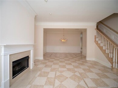 Tiled Living/Dining room with natural wood stair c