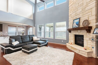 The stone fireplace in the living room is floor to ceiling and the high volume ceilings really make this home feel open, spacious and filled with natural light.