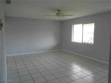 Empty room with baseboards, visible vents, and a c