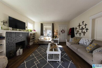 Lots of space and brick fireplace with gas logs.