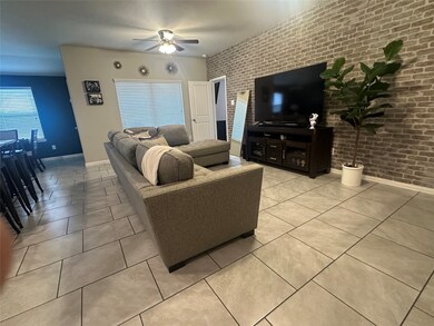 Family room with brick accent wall