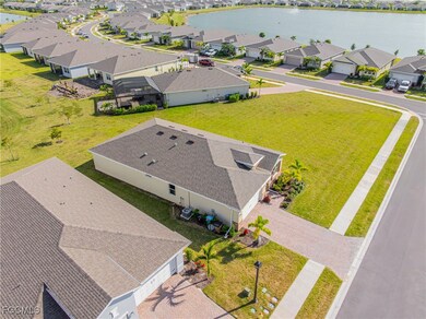 Aerial perspective of suburban area with a nearby body of water