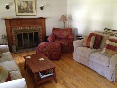 Living Room w/ Wood Burning Fireplace