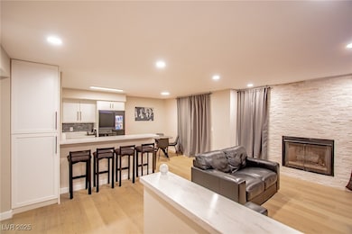 Living area featuring light wood-type flooring, a