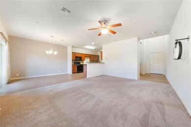Unfurnished living room featuring baseboards, cei