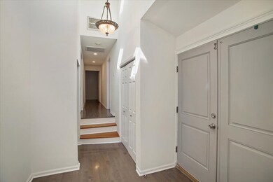 beautiful front door entry with lots of natural li