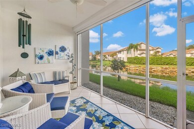 Sunroom featuring a water view and ceiling fan