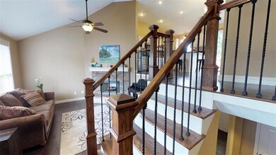 BEAUTIFUL HARDWOOD FLOORS THROUGHOUT AND WROUGHT IRON SPINDLES.