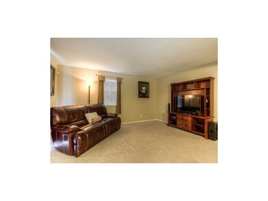 Living room with siding door to patio. Unit also f