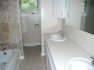 Main bath with double sinks and shower
