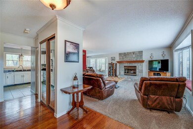 Beautiful Hardwood floors in foyer.  Newer carpet in Living room. Freshly Painted recently.  OPEN OPEN Floor plan