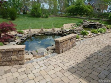 Closer view of 3 Tier Koi Pond with brick seating.