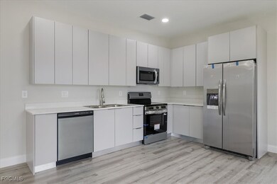 Kitchen featuring appliances with stainless steel