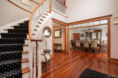 Stunning foyer with sweeping spiral staircase, gor