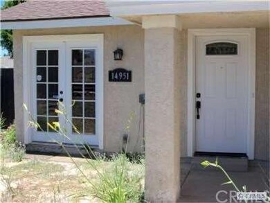 Front yard inside fence with french doors