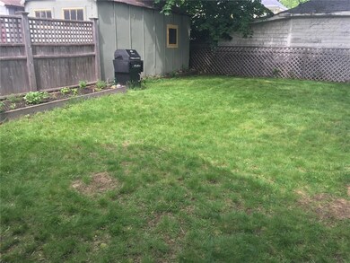 Grassy Yard With Raised Beds.