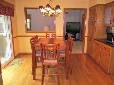 A newer slider leads to the patio and large fenced