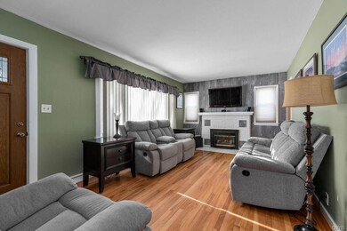 Living room with view of front entryway to the lef