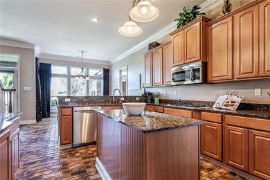 Gourmet kitchen with rustic brick floors, stainles