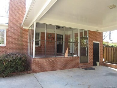 Carport and Glass Sunroom view.