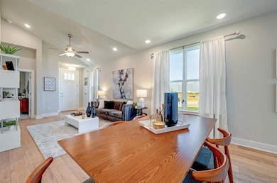Dining area with light wood-style floors, recesse